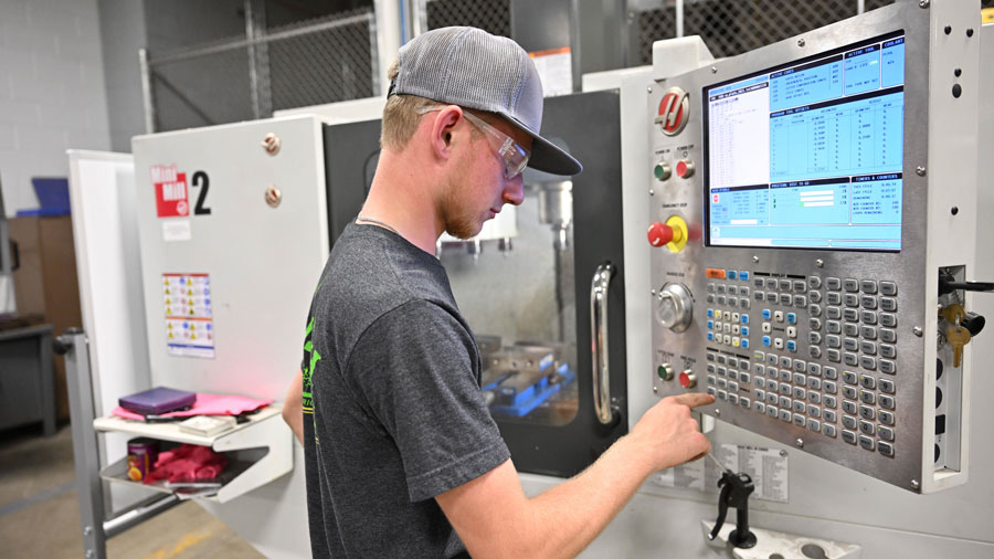 Student working on a CNC milling machine