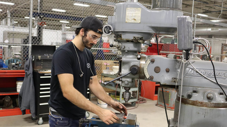 Student working on a milling machine