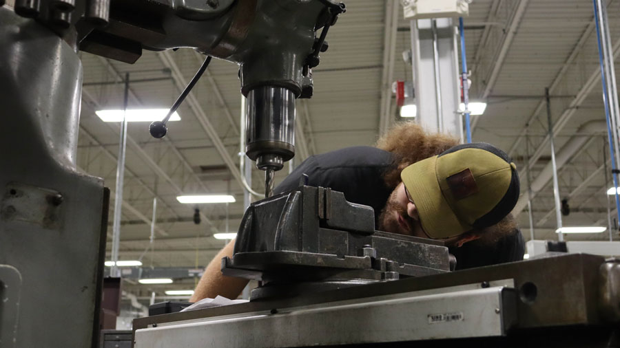 Student working on a milling machine