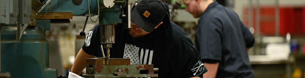 Student working on a milling machine