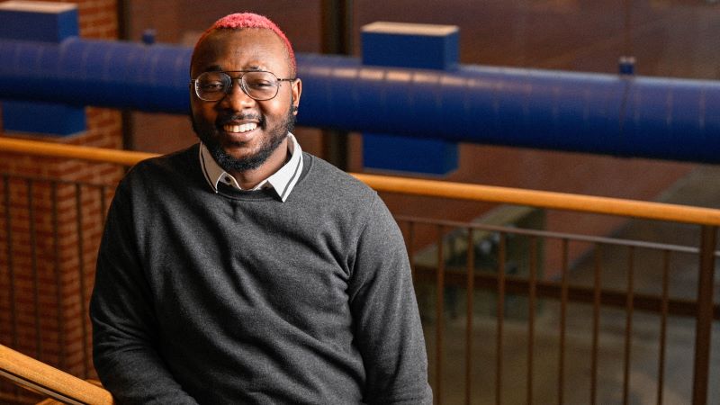 Student Oge Chukwu standing on the stairway at KCC. 