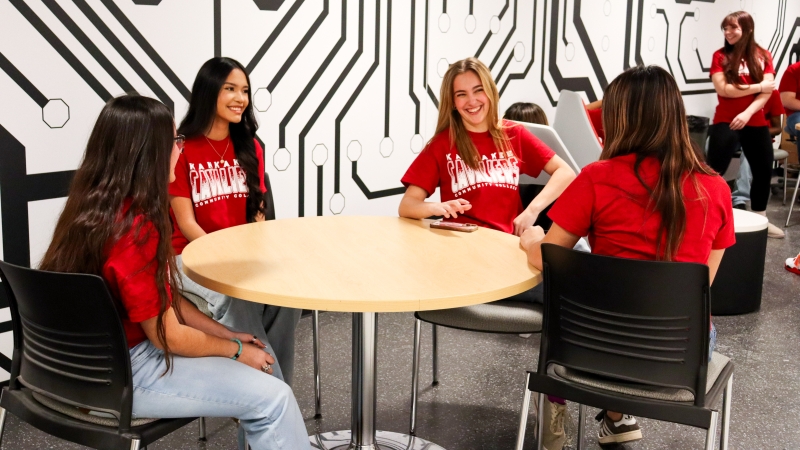 Early College Program 2025-2026 girls sitting around table in Industrial Tech building
