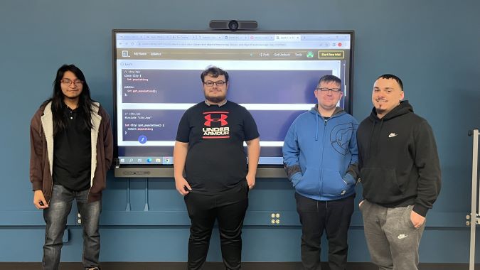 Four coding club students located in L355