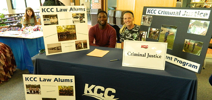 Two students at the American Criminal Justice Association's table at club rush