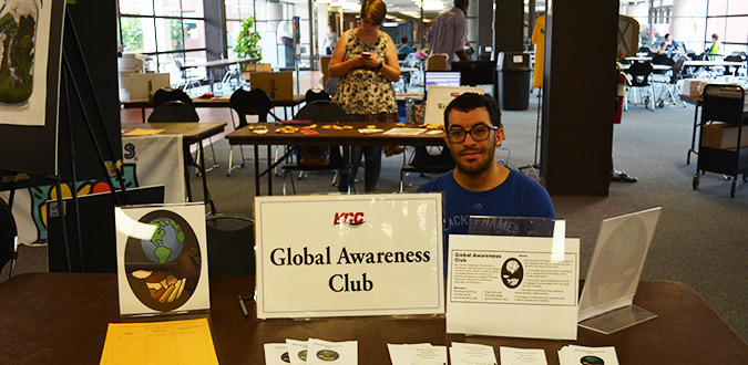 Student at the Global Awareness Club table at club rush