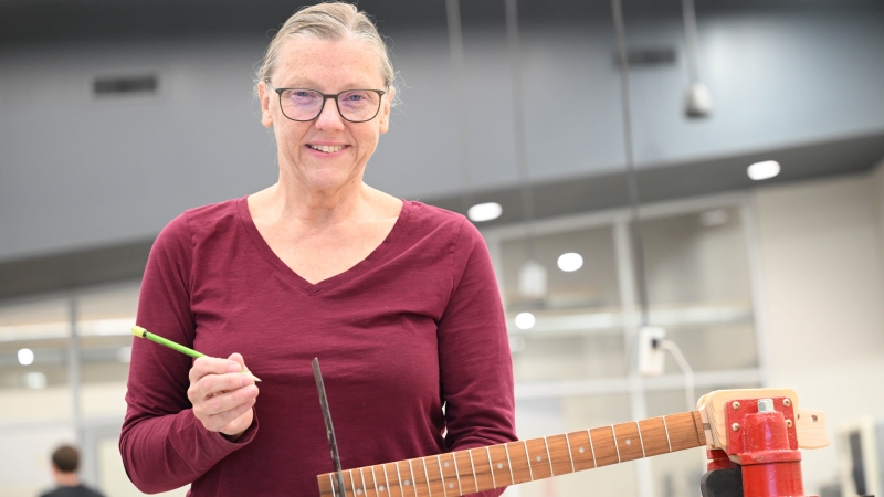 Karen Richards taking a guitar design class