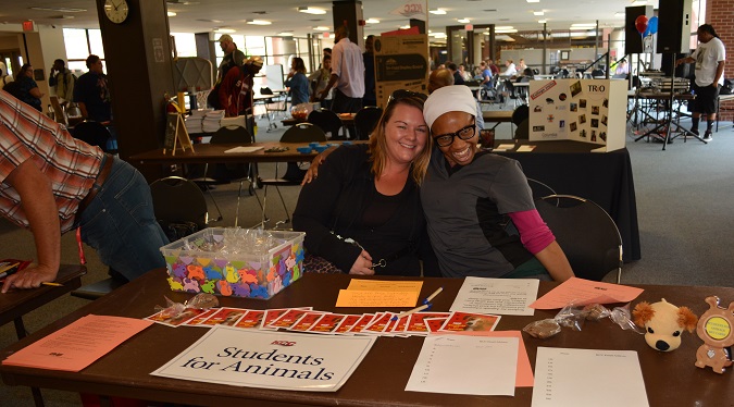 Two students at the Students for Animals club table at club rush